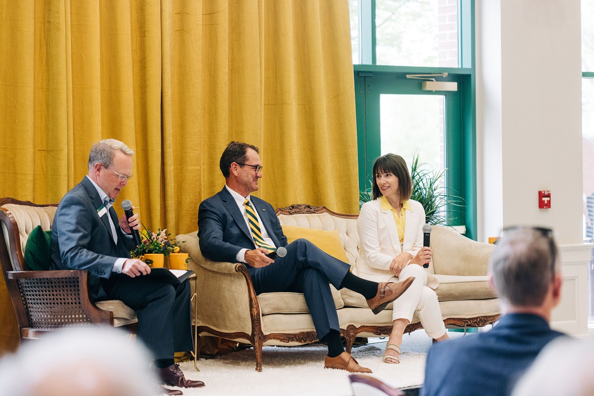 Photo: NDSU President David Cook and his wife, Dr. Katie Cook, chat with NDSU Foundation President and CEO John Glover at the McGovern Alumni Center at an event on May 24, 2022.